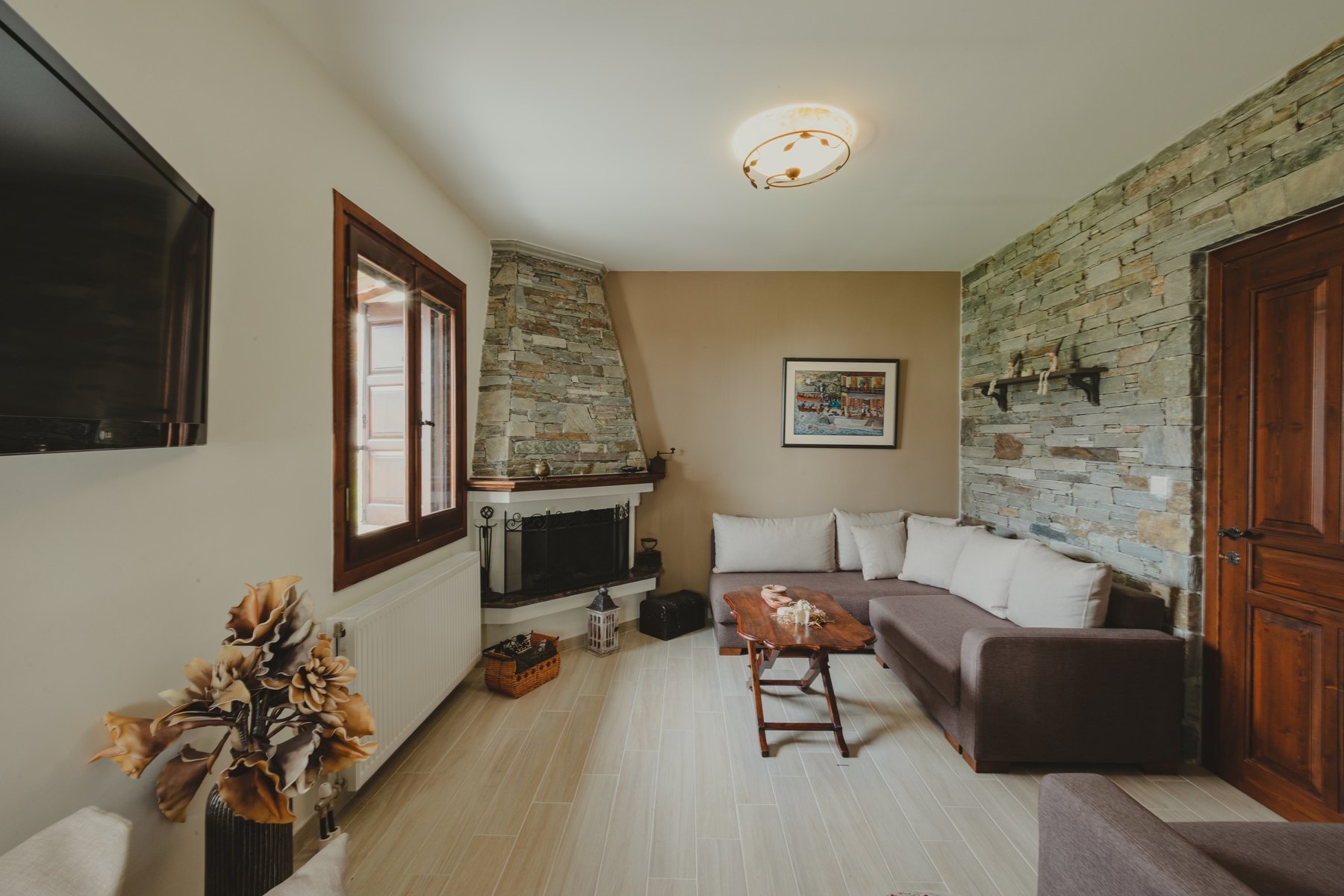 Living room with stone fireplace